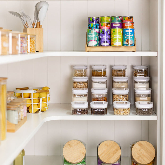 Organised White Flip Canister with labeled containers of dry goods