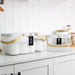 mesh metal basket with bamboo handle for home organisation, use in the kitchen, bathroom, laundry and more. 